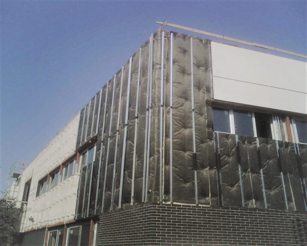 fachada edificio SATE aislamiento exterior para ahorro energético y limitación de humedades